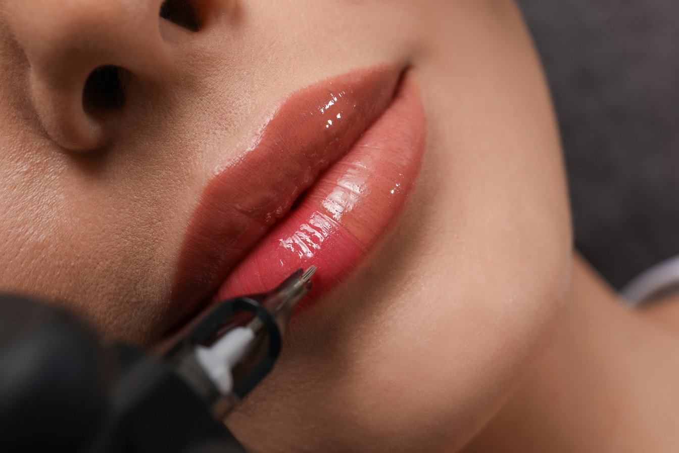 Young Woman Undergoing Procedure of Permanent Lip Makeup in Tatt